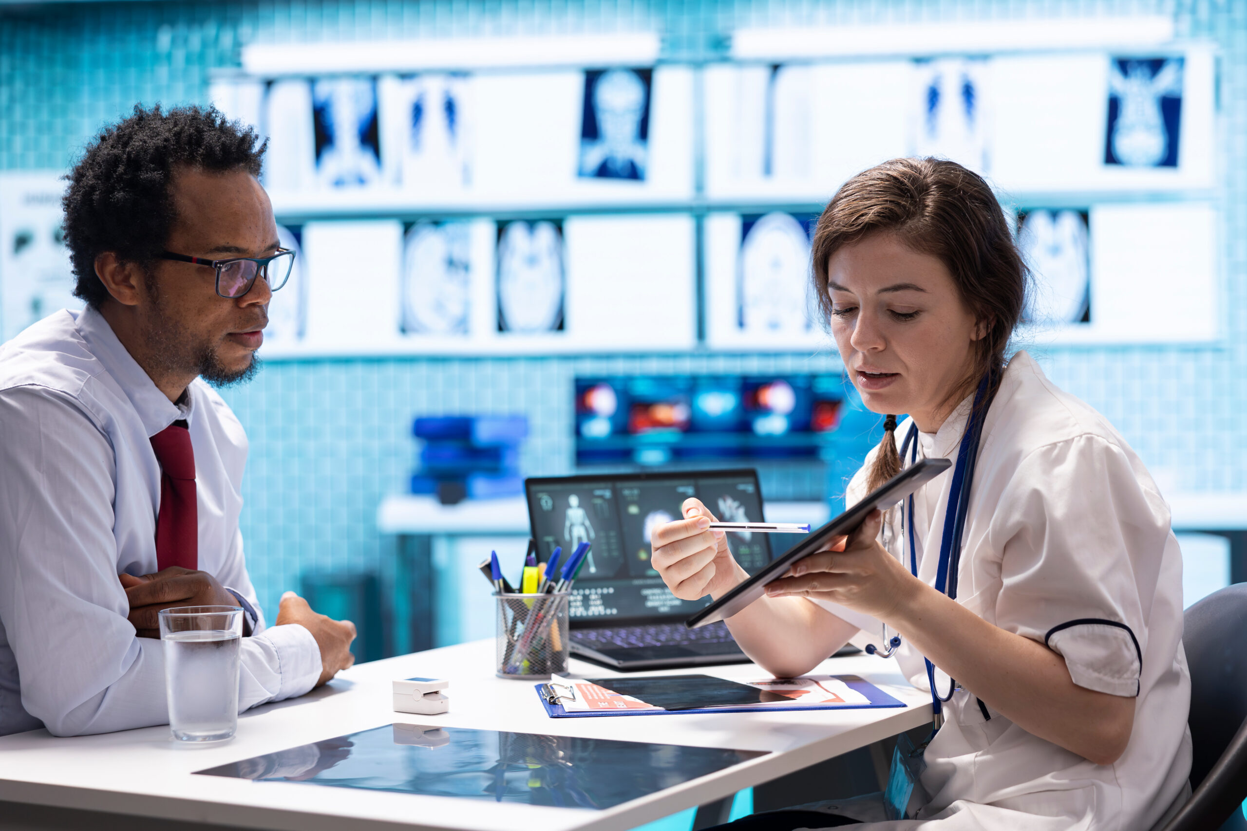 Medical provider reviewing patient treatment documents for PIP claim reimbursement in Brockton